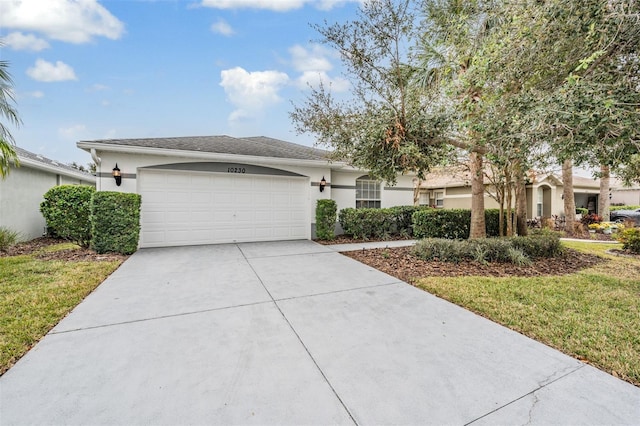 view of front of home with a front yard and a garage