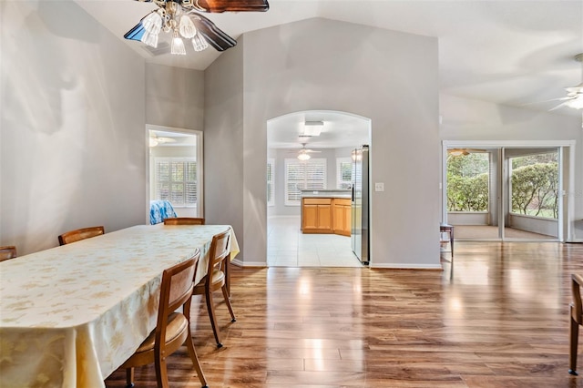 dining space featuring light hardwood / wood-style floors, ceiling fan, and a healthy amount of sunlight