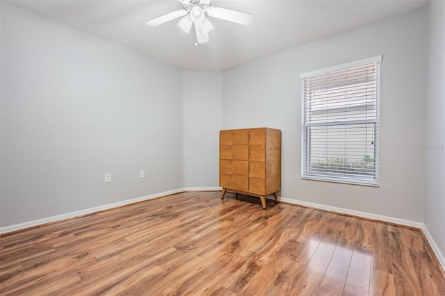 unfurnished room with ceiling fan and light hardwood / wood-style floors