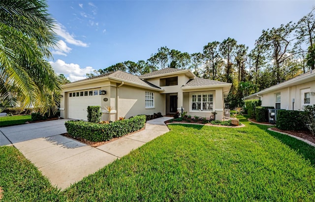 view of front facade featuring a garage and a front yard