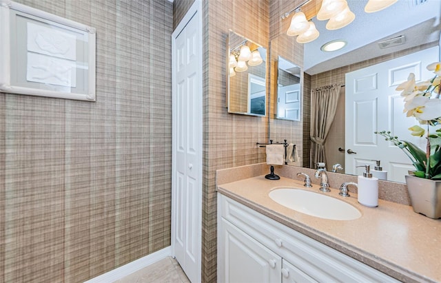 bathroom with vanity and tile patterned floors