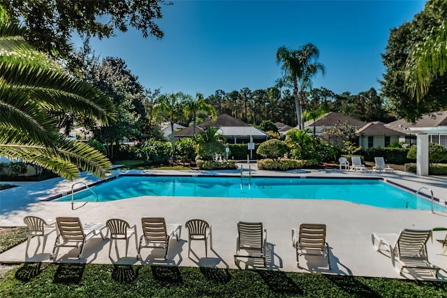 view of pool featuring a patio