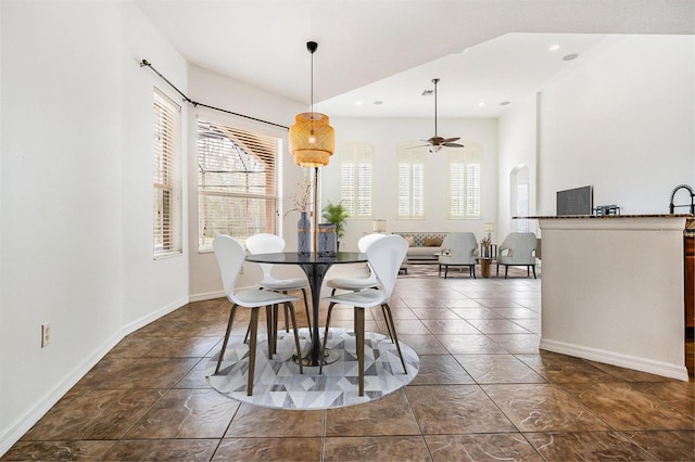 dining space with ceiling fan