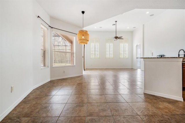 interior space featuring ceiling fan