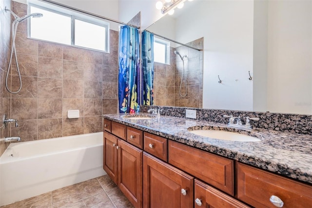 bathroom with shower / tub combo with curtain, vanity, and tile patterned flooring