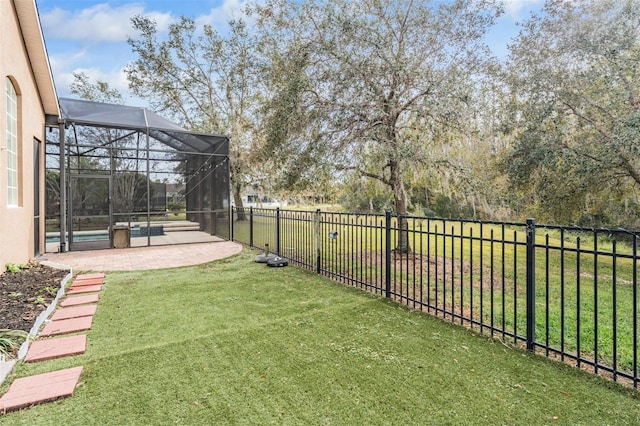 view of yard featuring a lanai and a patio area