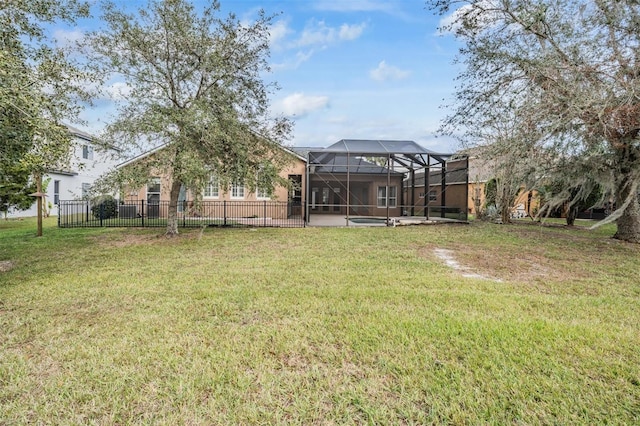 view of yard featuring glass enclosure