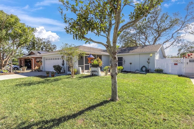 ranch-style house featuring a front lawn and a garage