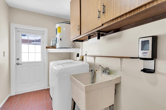 washroom featuring cabinet space, brick floor, water heater, separate washer and dryer, and a sink