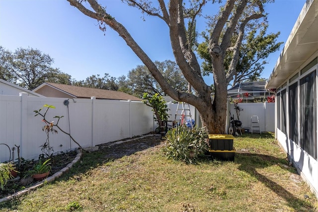 view of yard with a fenced backyard