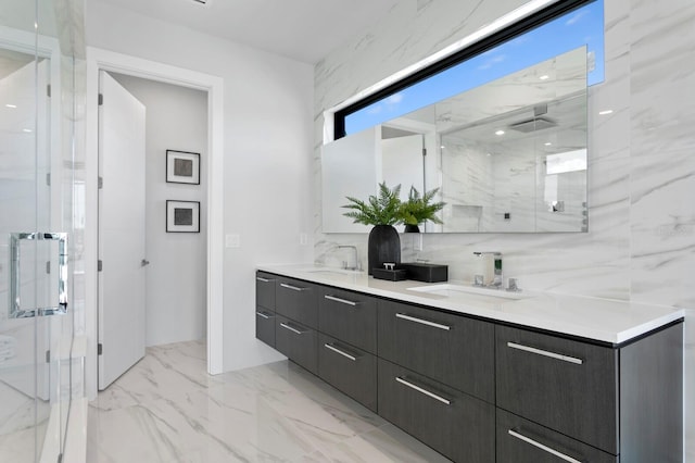 bathroom with vanity and a shower with shower door