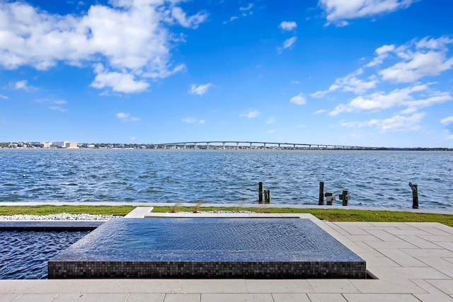 dock area featuring a water view