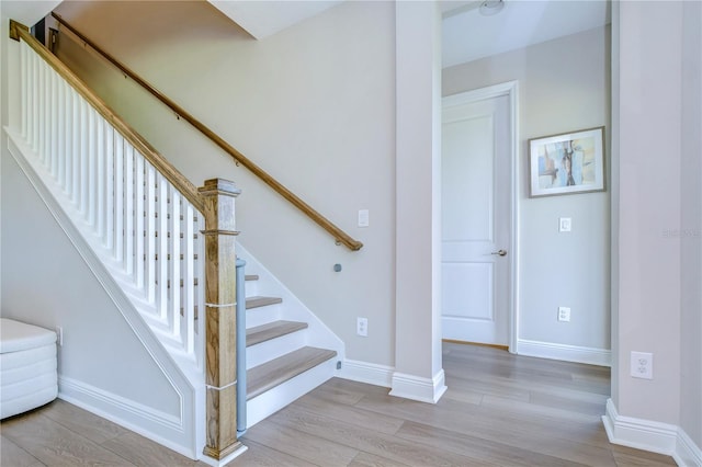 staircase featuring hardwood / wood-style floors