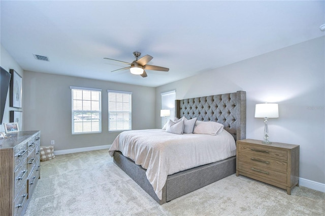 bedroom featuring light colored carpet and ceiling fan