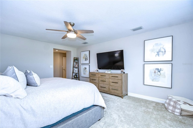 bedroom with ceiling fan and light carpet