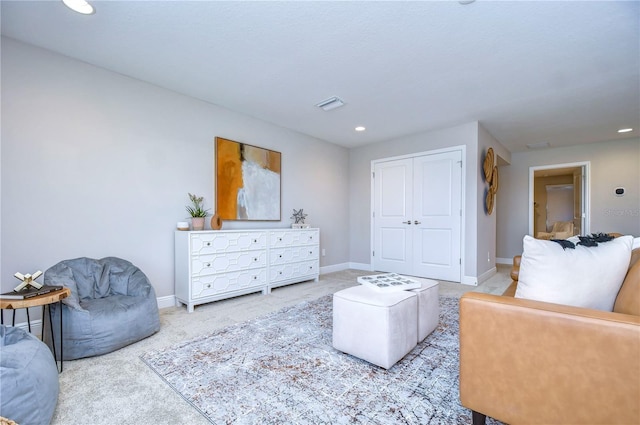 living room with light colored carpet