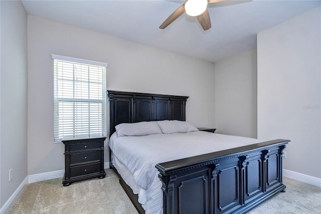 bedroom featuring light colored carpet and ceiling fan