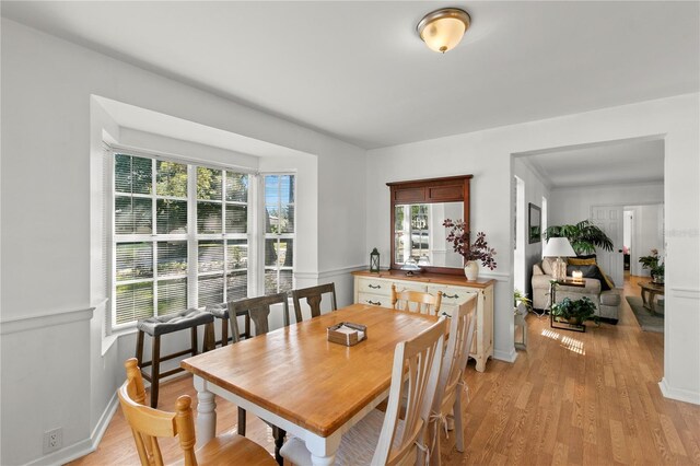 dining area with light hardwood / wood-style floors