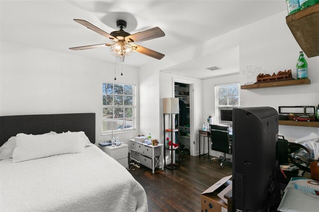 bedroom with ceiling fan and dark hardwood / wood-style flooring