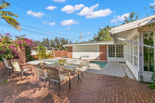 view of patio featuring a fenced in pool