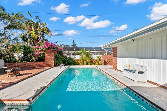 view of swimming pool with a patio