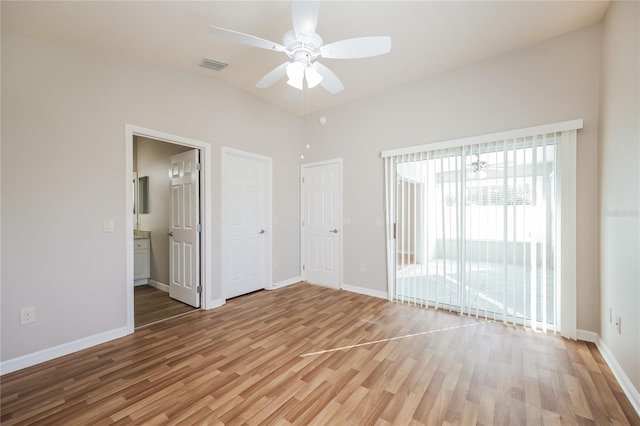 empty room featuring ceiling fan and wood-type flooring