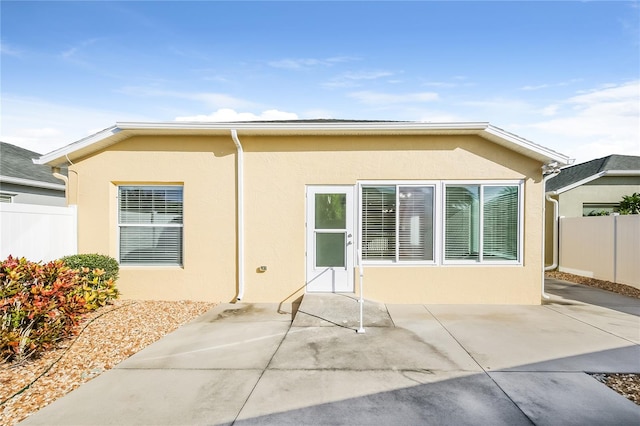 rear view of property with a patio