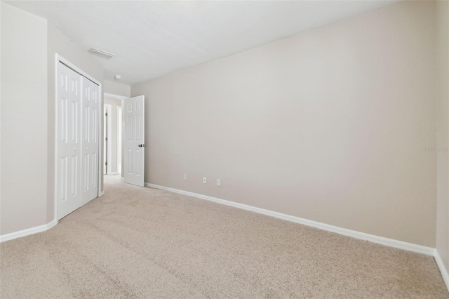 unfurnished bedroom with light carpet