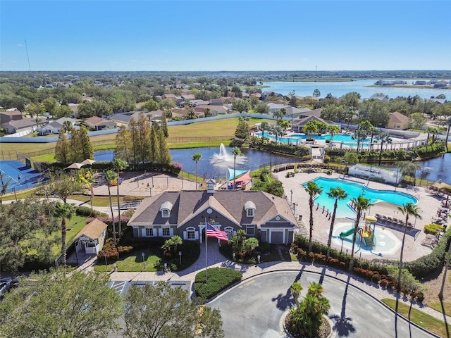 birds eye view of property with a water view