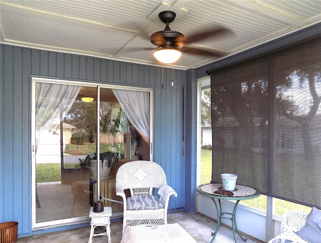 sunroom / solarium with ceiling fan