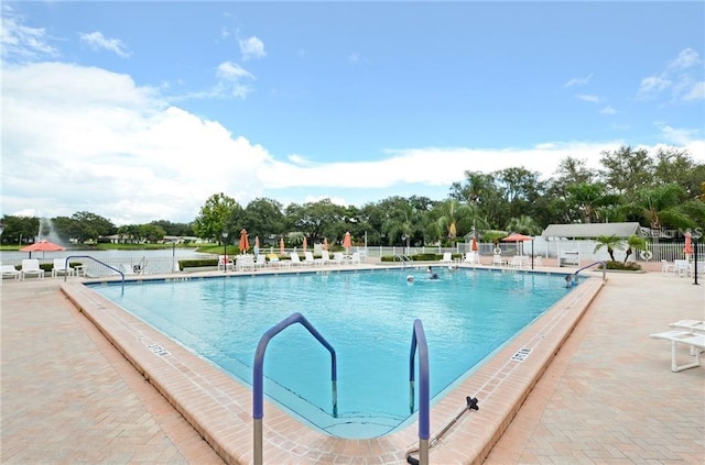 view of swimming pool with a patio