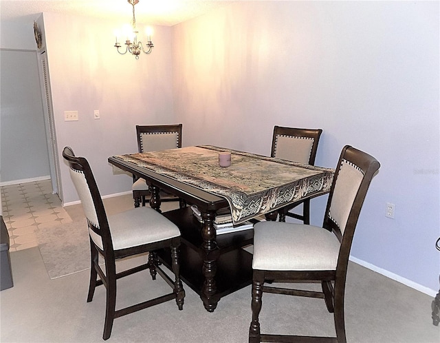 dining space featuring an inviting chandelier