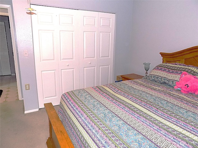 bedroom featuring carpet and a closet