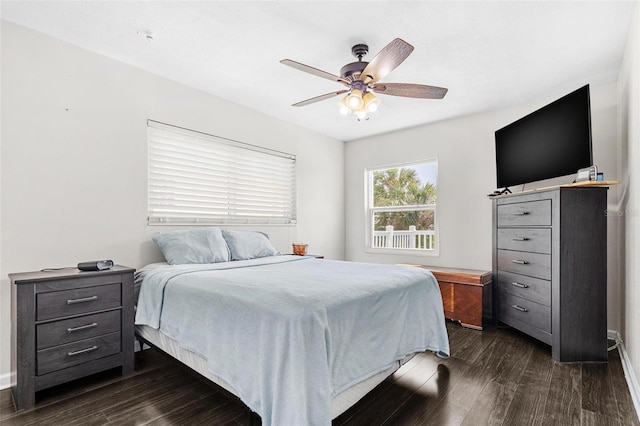 bedroom featuring ceiling fan and dark hardwood / wood-style floors