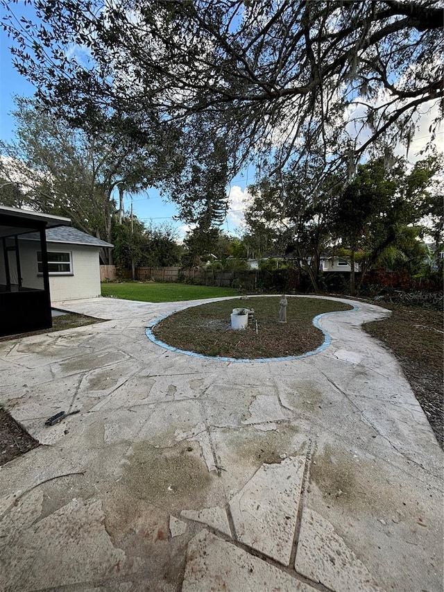 view of swimming pool with a yard