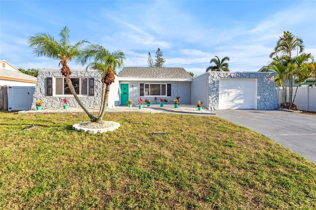 single story home featuring a garage and a front lawn