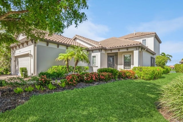 exterior space with a lawn and a garage