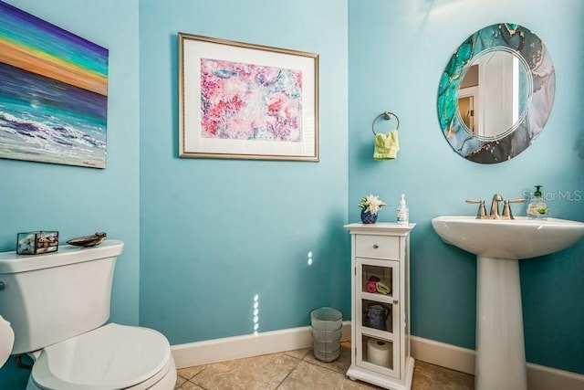 bathroom featuring tile patterned flooring and toilet