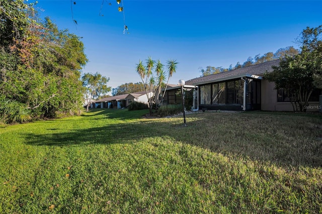 view of yard with a sunroom