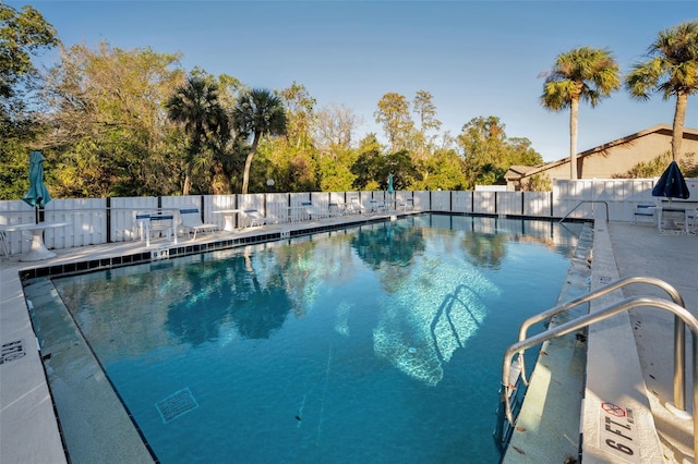 view of swimming pool featuring a patio