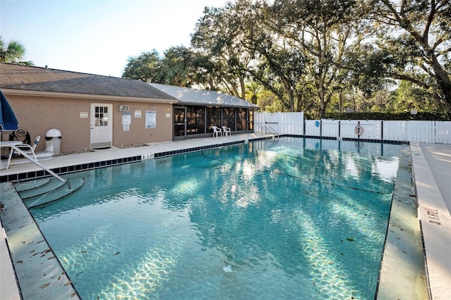 view of swimming pool with a patio