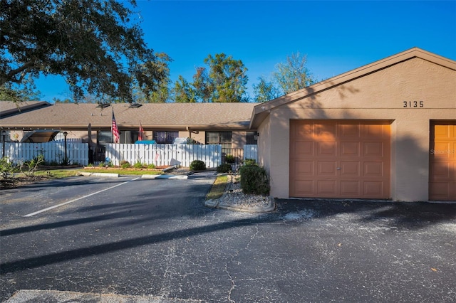 single story home featuring a garage