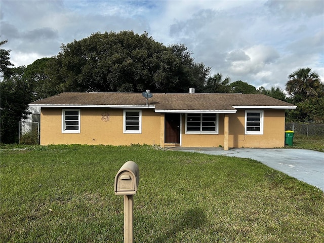 ranch-style home with a front yard