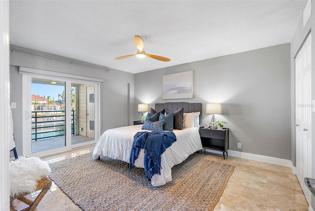 bedroom with ceiling fan and access to outside