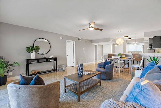 living room featuring ceiling fan