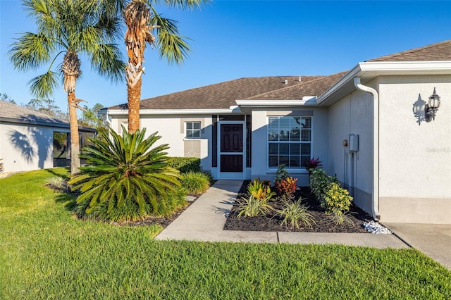 view of front of property with a front lawn