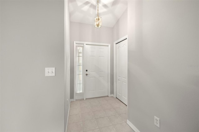 entryway with light tile patterned flooring