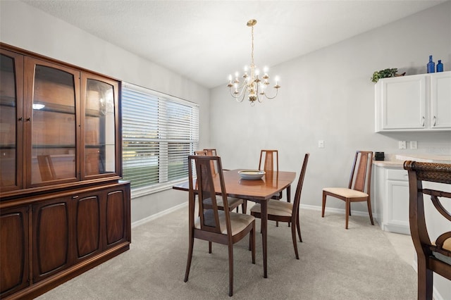 dining area with a notable chandelier and light carpet