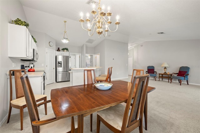 carpeted dining area with sink, a chandelier, and vaulted ceiling