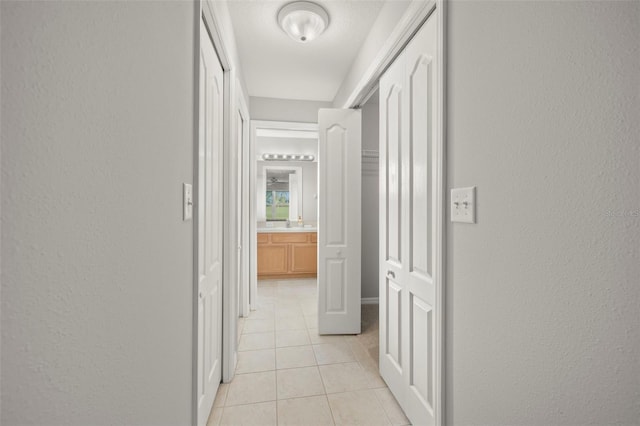 hallway with light tile patterned flooring